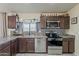 Functional kitchen featuring modern appliances, updated countertops, and a convenient layout at 8912 N Johnson Ct, Maricopa, AZ 85139