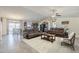 Open-concept living room seamlessly flowing into the kitchen and dining area, perfect for entertaining at 8912 N Johnson Ct, Maricopa, AZ 85139