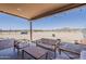 Covered patio with outdoor seating and views of the open desert landscape at 8912 N Johnson Ct, Maricopa, AZ 85139
