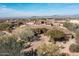 Expansive desert home with stunning mountain views and lush desert landscaping at 10010 E Blue Sky Dr, Scottsdale, AZ 85262