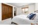 Bedroom with a view, closet with beautiful doors and an adjacent bathroom, promising a private retreat at 10010 E Blue Sky Dr, Scottsdale, AZ 85262