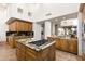 This kitchen has custom cabinetry, granite countertops, travertine floors, and high-end stainless steel appliances at 10010 E Blue Sky Dr, Scottsdale, AZ 85262