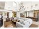 Open-concept living area featuring a fireplace, comfortable seating, and tile flooring at 10010 E Blue Sky Dr, Scottsdale, AZ 85262