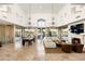 Spacious living room with high ceilings, large windows, fireplace, and tile flooring at 10010 E Blue Sky Dr, Scottsdale, AZ 85262