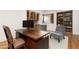 An inviting home office offers custom cabinetry, a granite countertop, and two comfortable chairs at 10010 E Blue Sky Dr, Scottsdale, AZ 85262