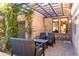 Outdoor patio area with wicker chairs and brick flooring, perfect for entertaining or relaxing outdoors at 10010 E Blue Sky Dr, Scottsdale, AZ 85262