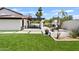 An outdoor patio area overlooks the manicured backyard, ideal for relaxation and entertaining at 101 E Linger Ln, Phoenix, AZ 85020