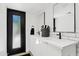 Modern bathroom featuring a double sink vanity with white countertops, black fixtures, and subway tile backsplash at 101 E Linger Ln, Phoenix, AZ 85020