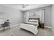 Bedroom featuring a grey bed frame, white bedding, and grey walls at 101 E Linger Ln, Phoenix, AZ 85020