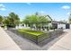A single story home with neat gravel landscaping, wooden privacy fence, and well-maintained lawn at 101 E Linger Ln, Phoenix, AZ 85020