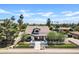 Charming home exterior featuring mature trees, manicured landscaping, and a black fence at 101 E Linger Ln, Phoenix, AZ 85020