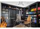 This is a stylish home office with dark built-in bookshelves, clear desk, and decorative accents at 101 E Linger Ln, Phoenix, AZ 85020