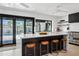 Gourmet kitchen featuring a large island with bar seating and stainless steel appliances at 101 E Linger Ln, Phoenix, AZ 85020
