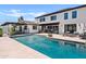 A stunning backyard pool is surrounded by lounge seating and manicured landscaping, perfect for entertaining at 101 E Linger Ln, Phoenix, AZ 85020