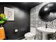 Stylish powder room with unique tile accent wall, modern fixtures, and sophisticated decor at 101 E Linger Ln, Phoenix, AZ 85020