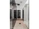 Modern shower featuring glass enclosure and black marble tile at 101 E Linger Ln, Phoenix, AZ 85020