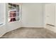 Cozy bedroom featuring soft carpeting, a window, and a closet door at 10242 N 66Th Ave, Glendale, AZ 85302