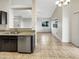 Open kitchen with a view of the living area, complete with stainless steel appliances and ample counter space at 10242 N 66Th Ave, Glendale, AZ 85302