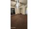 Cozy bedroom featuring carpeted floors and a sliding glass door to the patio at 10582 W Oakmont Dr, Sun City, AZ 85351