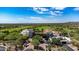 Aerial view of a desert community with a golf course and well-maintained landscape at 12725 W Forest Pleasant Pl, Peoria, AZ 85383