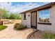 Inviting backyard with a built-in barbecue, decorative rock, and beautiful flowering plants at 12725 W Forest Pleasant Pl, Peoria, AZ 85383