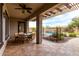 Covered patio with travertine tile, a pergola, and a view of the beautiful pool at 12725 W Forest Pleasant Pl, Peoria, AZ 85383