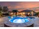 Resort-style pool and spa with outdoor living spaces and a covered patio at 12725 W Forest Pleasant Pl, Peoria, AZ 85383