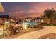 Private backyard featuring desert landscaping and inviting pool with spa at 12725 W Forest Pleasant Pl, Peoria, AZ 85383