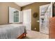 Bedroom featuring a cozy bed, window shutters, and ample natural light at 12725 W Forest Pleasant Pl, Peoria, AZ 85383