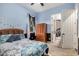 Bedroom featuring a bed, window with curtains, dresser, and closet at 12725 W Forest Pleasant Pl, Peoria, AZ 85383