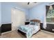 Bedroom featuring a comfortable bed, ceiling fan, and natural light at 12725 W Forest Pleasant Pl, Peoria, AZ 85383