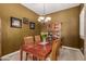 Formal dining room showcasing a wooden table set, china cabinet, and decorative chandelier at 12725 W Forest Pleasant Pl, Peoria, AZ 85383