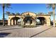 Grand entrance with arched entryway, lush landscaping, and decorative brick paving at 12725 W Forest Pleasant Pl, Peoria, AZ 85383