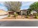 Charming home with a well-manicured front yard and cozy curb appeal during daytime at 12725 W Forest Pleasant Pl, Peoria, AZ 85383