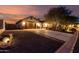 Beautiful exterior with long driveway, mature landscaping and a two-car garage at 12725 W Forest Pleasant Pl, Peoria, AZ 85383