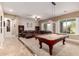 Spacious game room area with a pool table and comfortable seating at 12725 W Forest Pleasant Pl, Peoria, AZ 85383