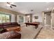 Entertainment game room featuring a pool table, ceiling fan, and window with shutters at 12725 W Forest Pleasant Pl, Peoria, AZ 85383