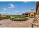 Expansive outdoor patio with fountain, seating, and views of the surrounding landscape at 12725 W Forest Pleasant Pl, Peoria, AZ 85383