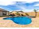 Inviting backyard with a pristine blue pool, elegant patio furniture, and lush landscaping at 12725 W Forest Pleasant Pl, Peoria, AZ 85383