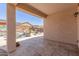 Covered patio offering views of the backyard pool and surrounding outdoor area with cozy seating at 18388 W Ida Ln, Surprise, AZ 85387