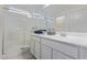 Clean, well-lit bathroom with glass-enclosed shower, single sink, and granite countertop at 18388 W Ida Ln, Surprise, AZ 85387