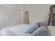 Serene bedroom featuring a plush bed with soft pillows and a closet with sleek white doors at 18388 W Ida Ln, Surprise, AZ 85387