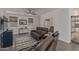 Open-concept living room featuring tile flooring, plush seating, and plenty of natural light at 18388 W Ida Ln, Surprise, AZ 85387