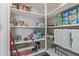 Walk-in pantry with white shelving providing ample storage space for food and household items at 18388 W Ida Ln, Surprise, AZ 85387