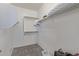 Functional walk-in closet with ample shelving and storage solutions at 18388 W Ida Ln, Surprise, AZ 85387
