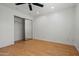 Bedroom boasts mirrored closet doors, wood floors, and natural light at 1850 E Maryland Ave # 18, Phoenix, AZ 85016