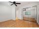 Bedroom features mirrored closet doors, wood floors, and an open doorway at 1850 E Maryland Ave # 18, Phoenix, AZ 85016