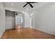 Bright bedroom features hardwood floors, neutral paint, closet and ceiling fan at 1850 E Maryland Ave # 18, Phoenix, AZ 85016