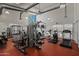 Well-equipped gym with modern fitness machines, weight racks, and ample natural light at 1850 E Maryland Ave # 18, Phoenix, AZ 85016