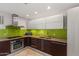 Modern kitchen features stainless steel appliances and stylish backsplash at 1850 E Maryland Ave # 18, Phoenix, AZ 85016